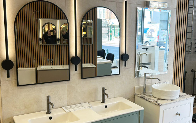 Stylish bathroom display featuring mirrors and vanity basins